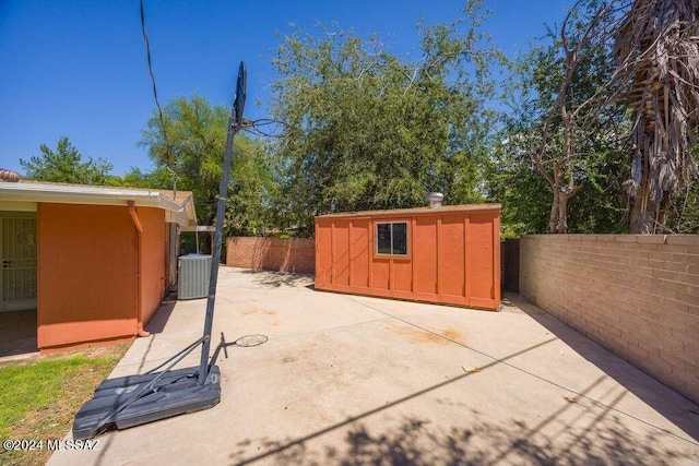 view of patio / terrace with a storage unit and cooling unit