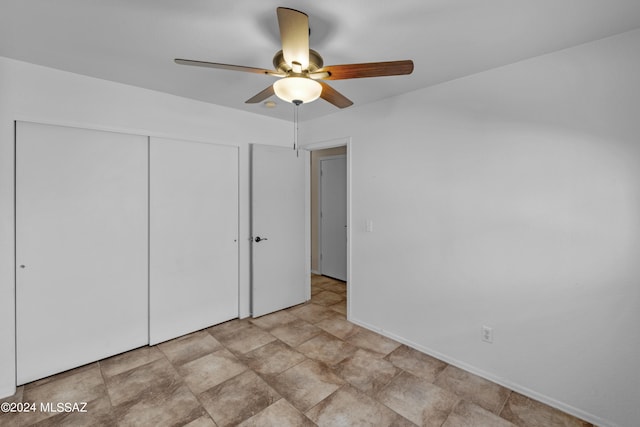 unfurnished bedroom with a closet, ceiling fan, and light tile patterned floors