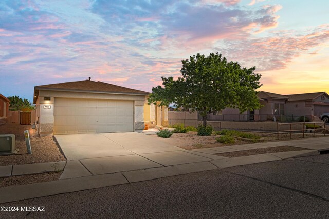 view of front of property featuring a garage