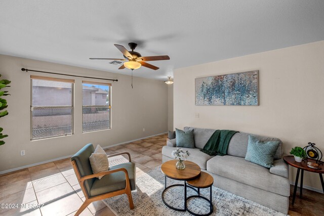 tiled living room featuring ceiling fan