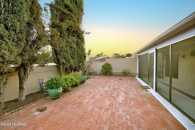 view of patio terrace at dusk