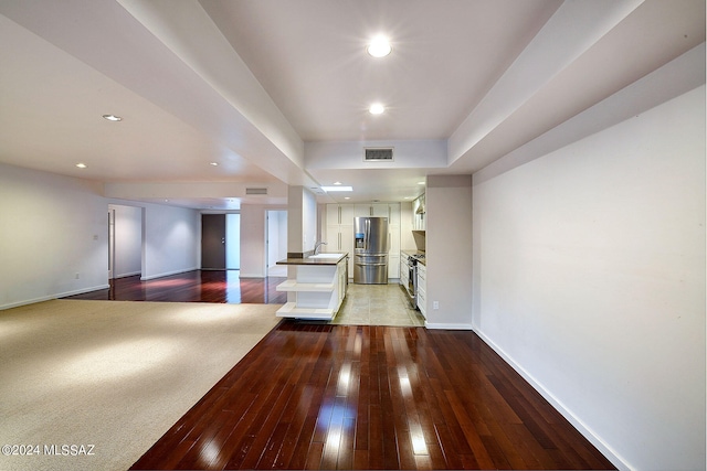 interior space with sink and hardwood / wood-style floors