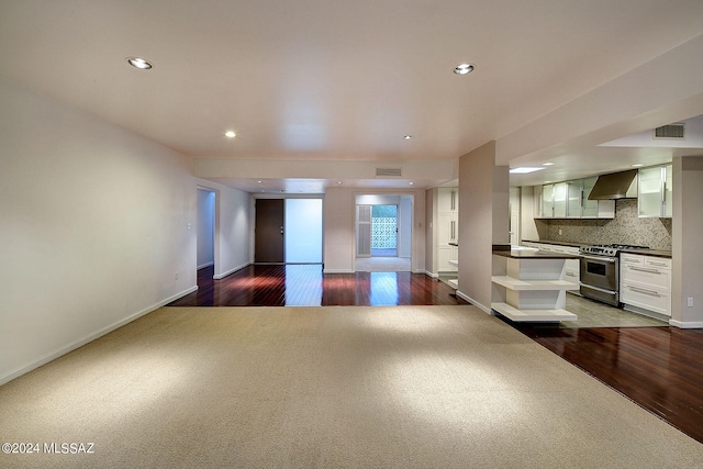 unfurnished living room with hardwood / wood-style floors