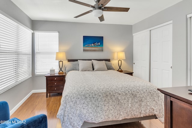 bedroom featuring a closet, ceiling fan, and light hardwood / wood-style floors