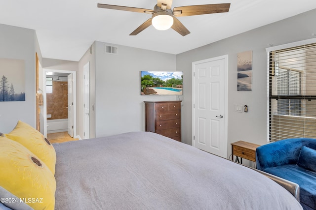 bedroom featuring ceiling fan and ensuite bathroom