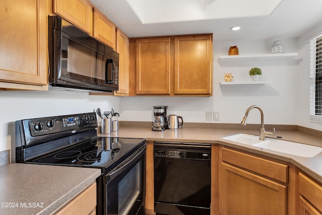 kitchen featuring black appliances and sink