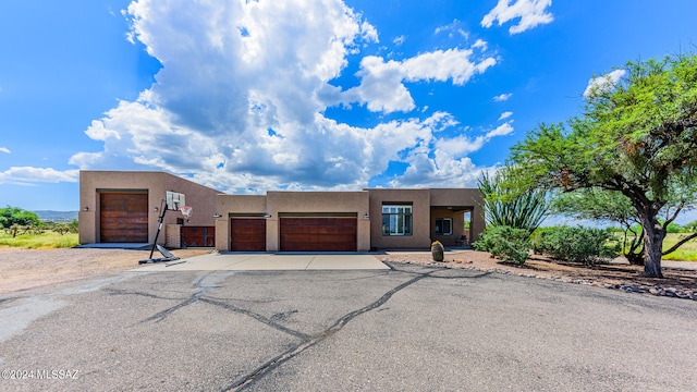 adobe home featuring a garage