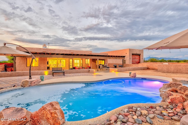 view of swimming pool featuring a patio area