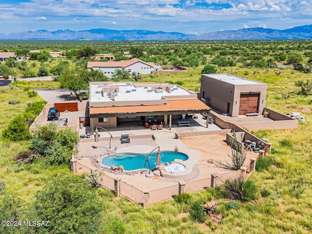 birds eye view of property with a mountain view