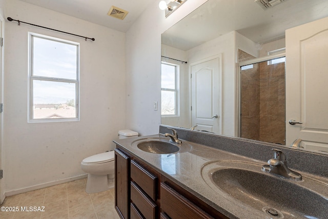 bathroom with a healthy amount of sunlight, visible vents, and a sink