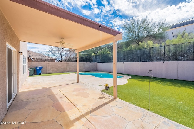 view of patio / terrace with ceiling fan, a fenced backyard, and a fenced in pool