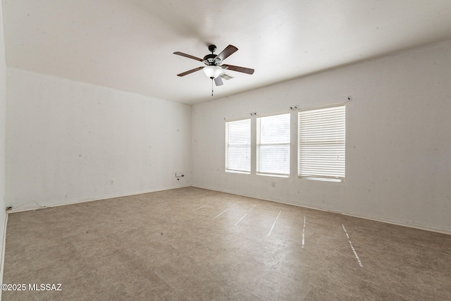 spare room featuring visible vents and a ceiling fan