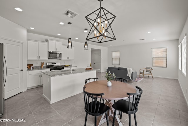 interior space with an inviting chandelier and sink