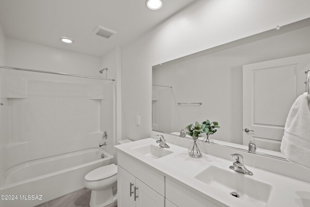 full bathroom featuring shower / bath combination, toilet, and vanity