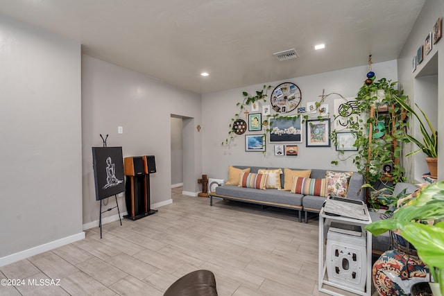 living room with light hardwood / wood-style flooring