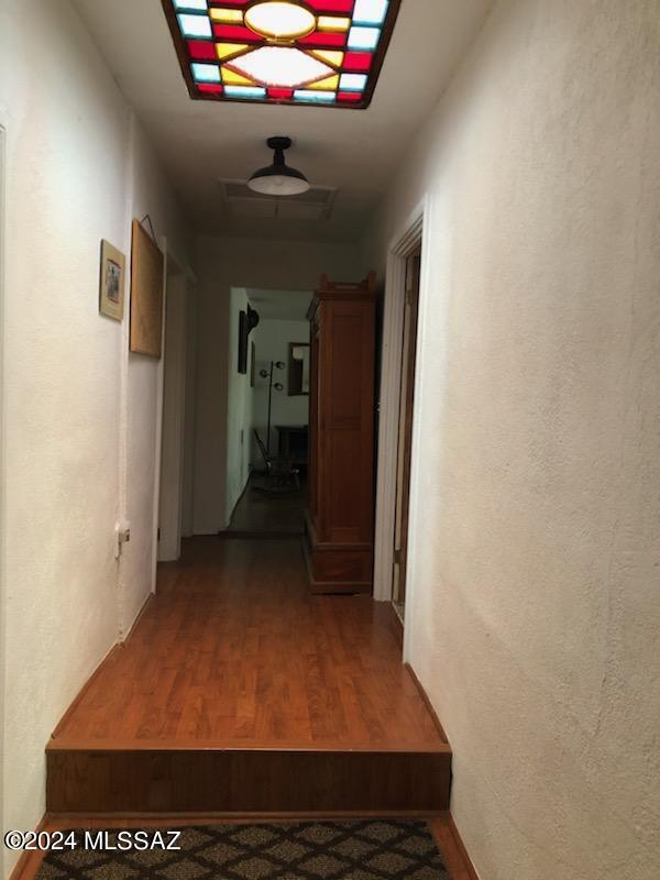 hallway featuring wood-type flooring