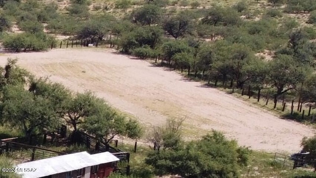 birds eye view of property with a rural view