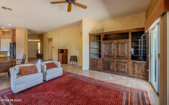 living area featuring a ceiling fan, recessed lighting, visible vents, and light tile patterned floors