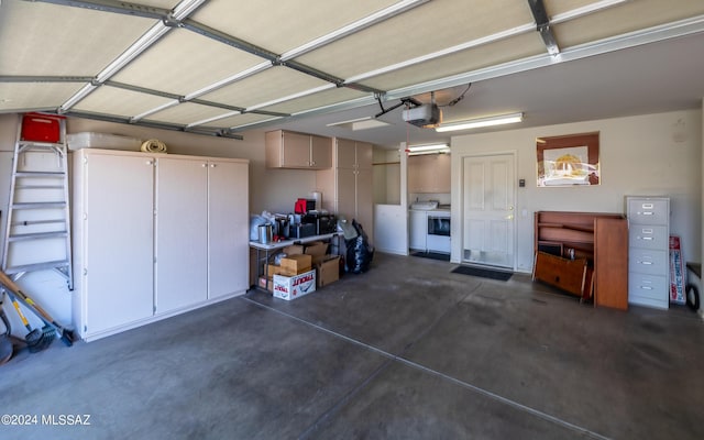 garage featuring a garage door opener and washing machine and dryer