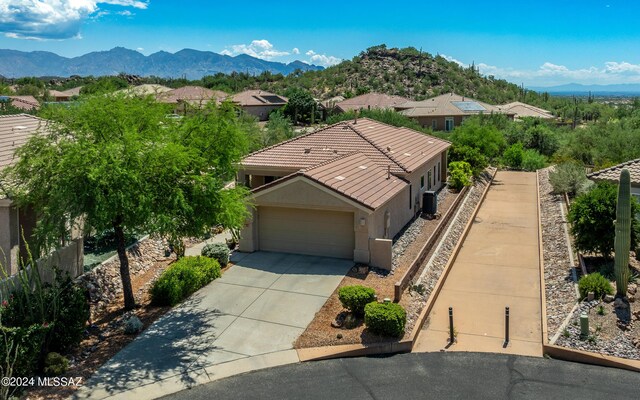 birds eye view of property featuring a mountain view