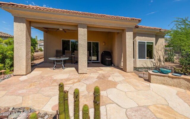 rear view of house featuring a patio