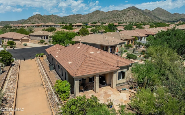 drone / aerial view with a residential view and a mountain view