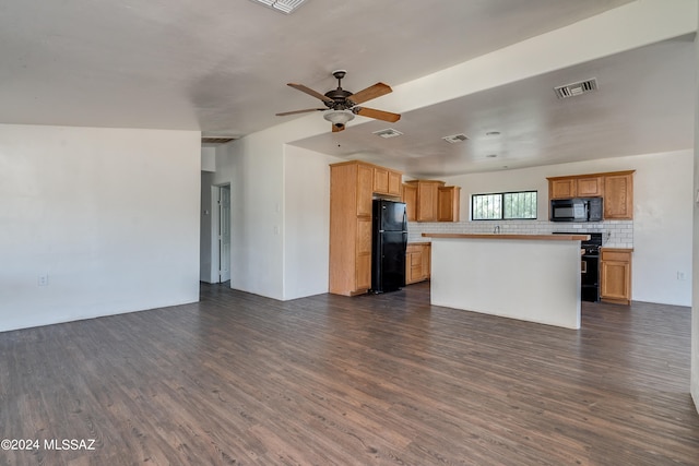 unfurnished living room with dark hardwood / wood-style flooring and ceiling fan