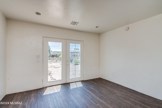 entryway with dark wood-type flooring and french doors