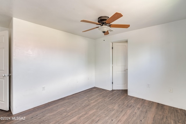 empty room featuring ceiling fan and hardwood / wood-style flooring