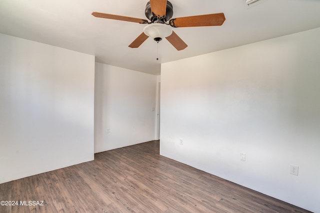 spare room featuring hardwood / wood-style flooring and ceiling fan