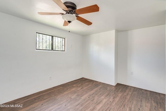 spare room featuring ceiling fan and hardwood / wood-style floors