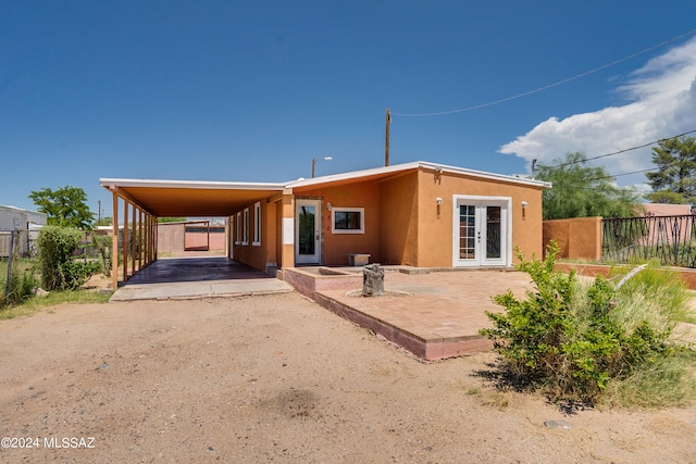 rear view of house with a carport