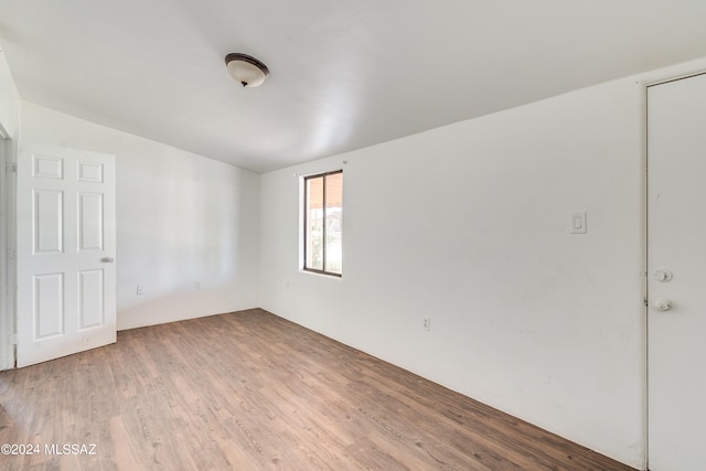 spare room featuring hardwood / wood-style flooring