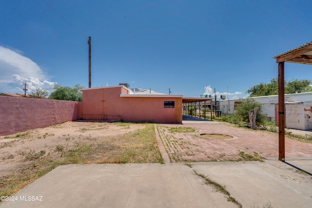 rear view of house featuring a patio