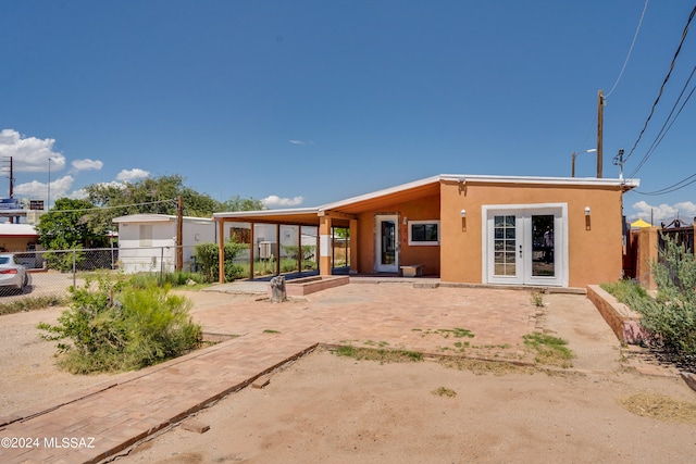 back of property with a patio