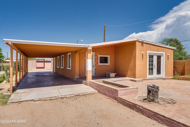 exterior space with a carport