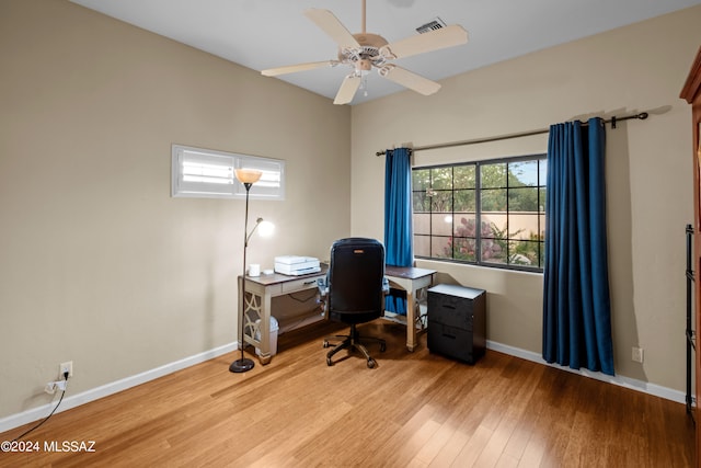 home office featuring ceiling fan and hardwood / wood-style flooring