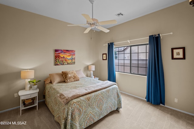 carpeted bedroom with ceiling fan