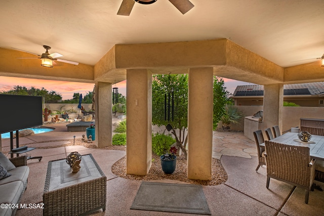 view of patio featuring a fenced in pool, outdoor lounge area, and ceiling fan