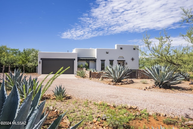 southwest-style home with a garage