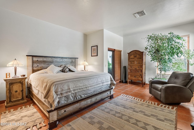 tiled bedroom with multiple windows