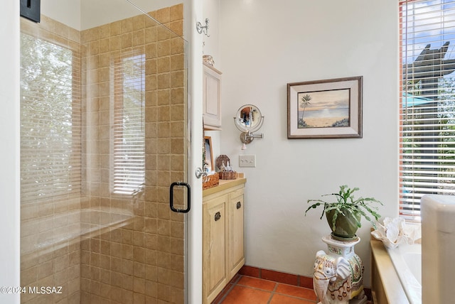 bathroom with shower with separate bathtub and tile patterned floors