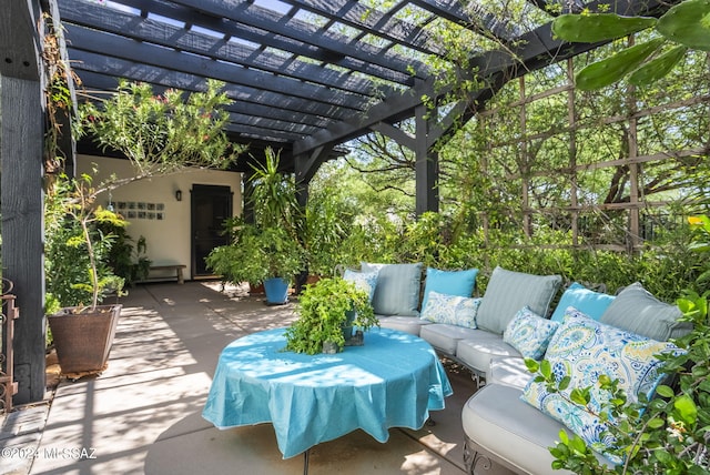 view of patio featuring an outdoor living space and a pergola