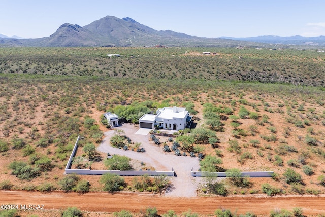 birds eye view of property with a mountain view