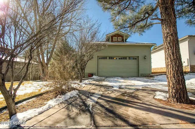 view of snow covered garage