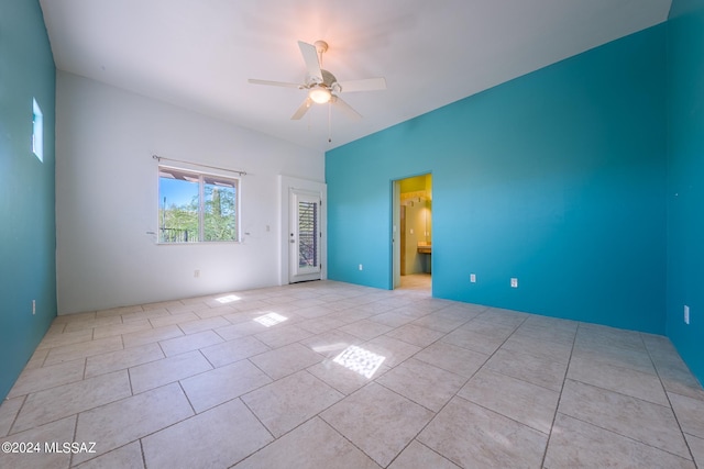 unfurnished room with light tile patterned floors and ceiling fan