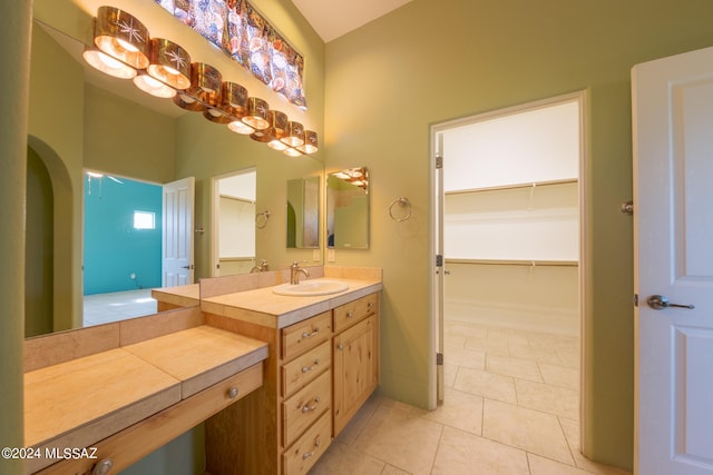 bathroom with tile patterned flooring and vanity