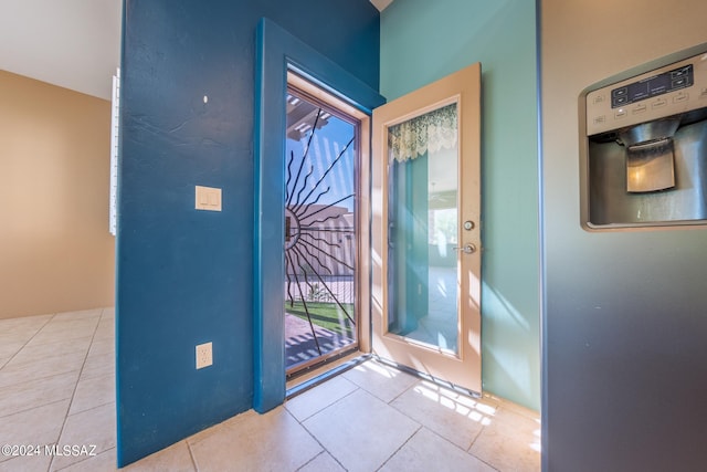 foyer featuring light tile patterned floors