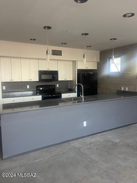 kitchen with sink, hanging light fixtures, black appliances, and white cabinetry