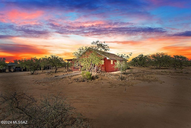 yard at dusk with an outbuilding